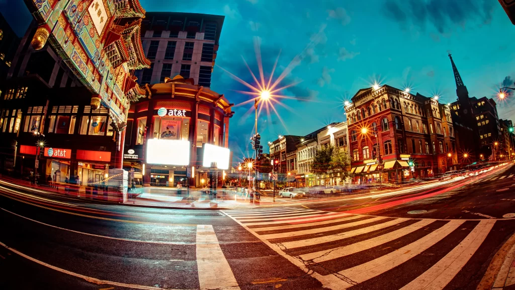 city street night lights buildings crosswalk