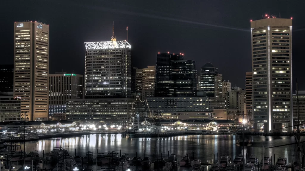 cityscape night lights buildings water reflection