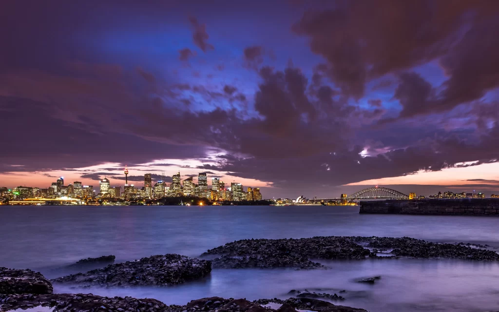 cityscape skyline sunset clouds water bridge