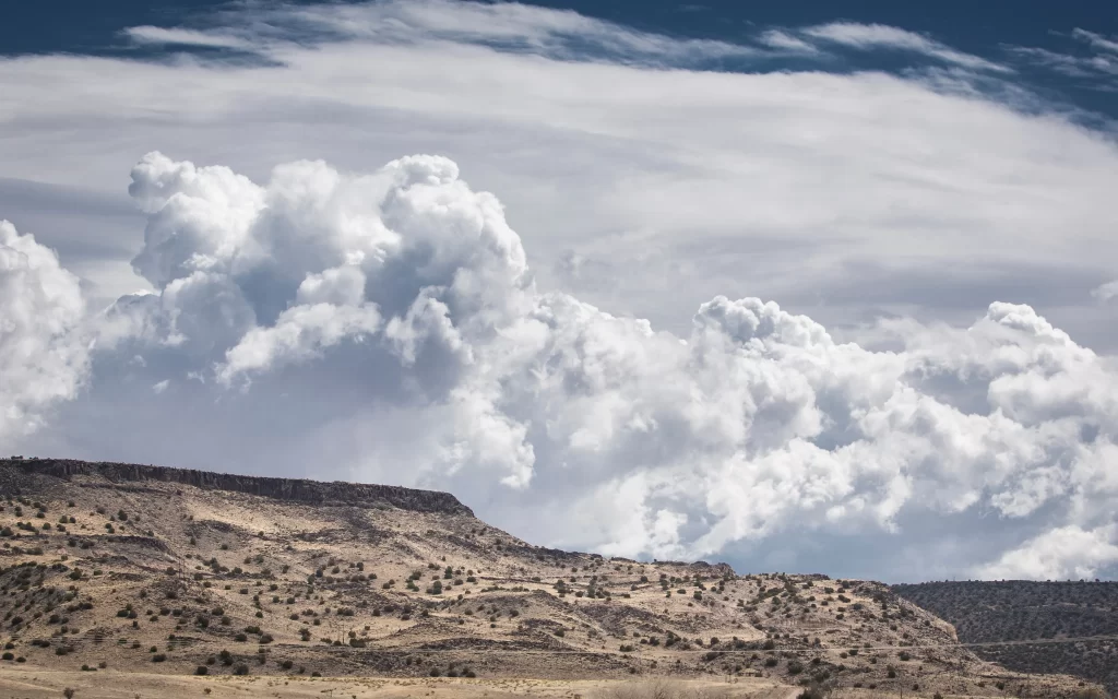clouds landscape sky desert terrain