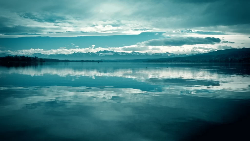 clouds water reflection mountains sky landscape