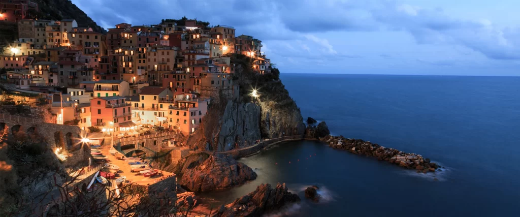 Coastal Town Cliffside Sea Evening Lights Architecture