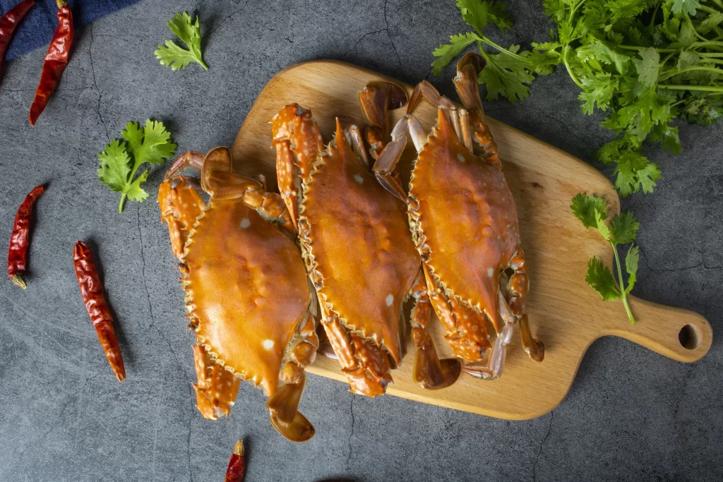 Cooked Crabs Brown Shell Wooden Cutting Board