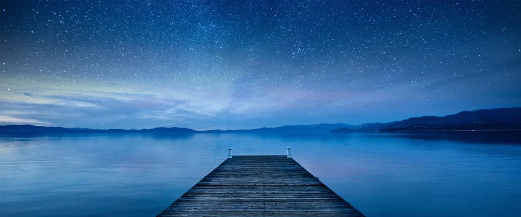 dock lake night stars mountains serene