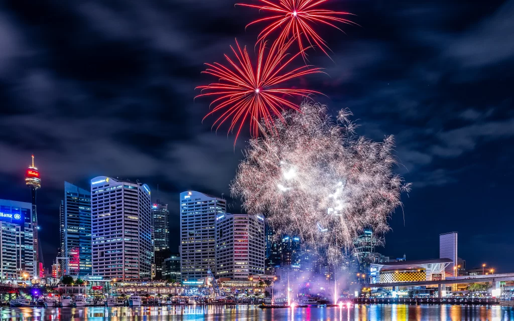 fireworks cityscape night celebration reflection buildings
