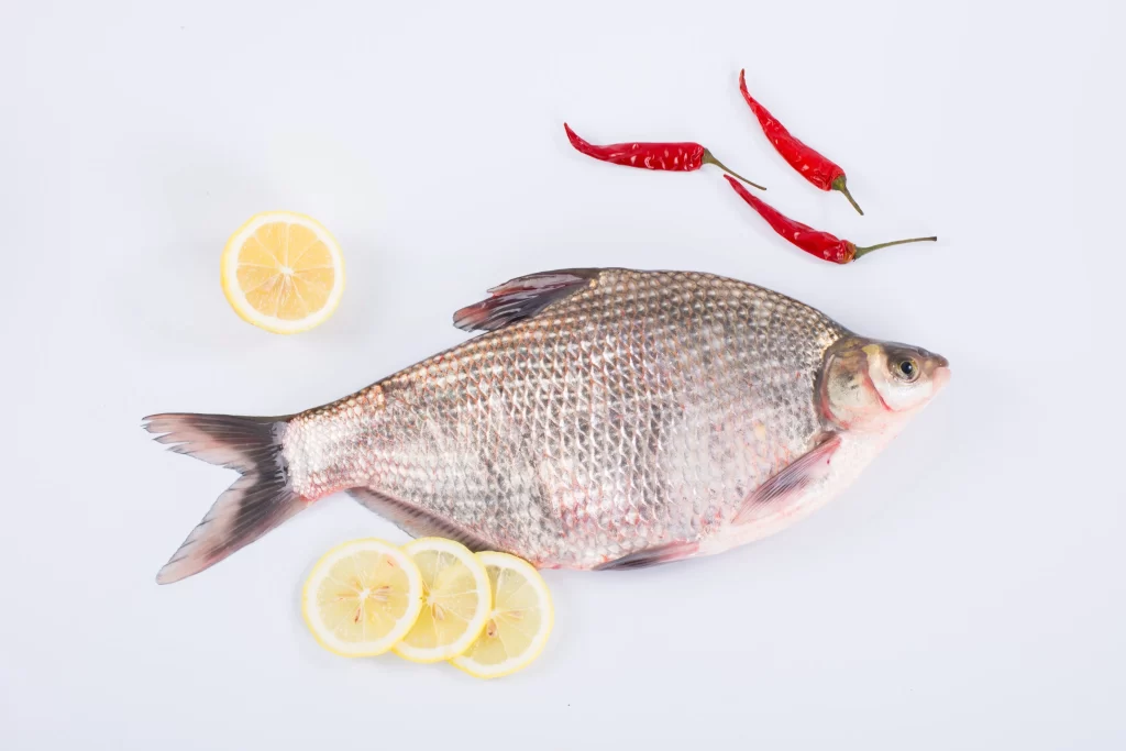 Fresh Fish Silver Scales Lemon Slices Red Chilies
