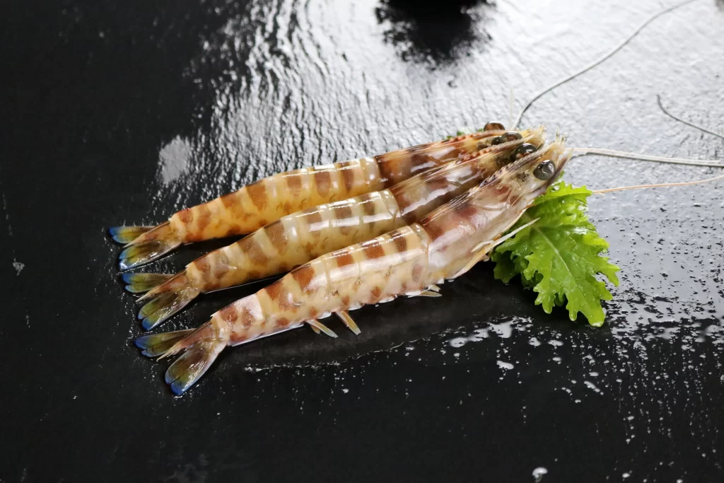 Fresh Shrimp Brown Shell Green Lettuce Black Background