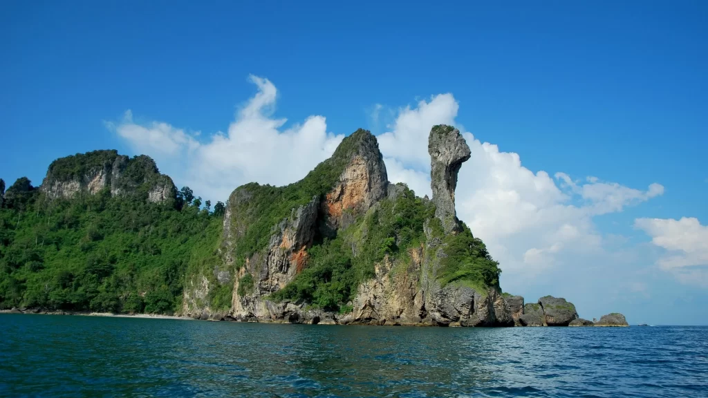 island sea sky clouds rock vegetation