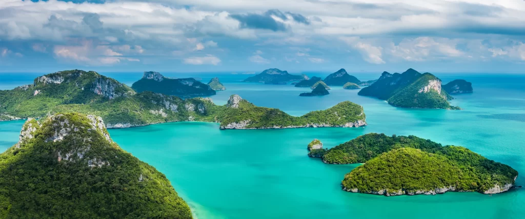 islands turquoise water lush greenery sky clouds