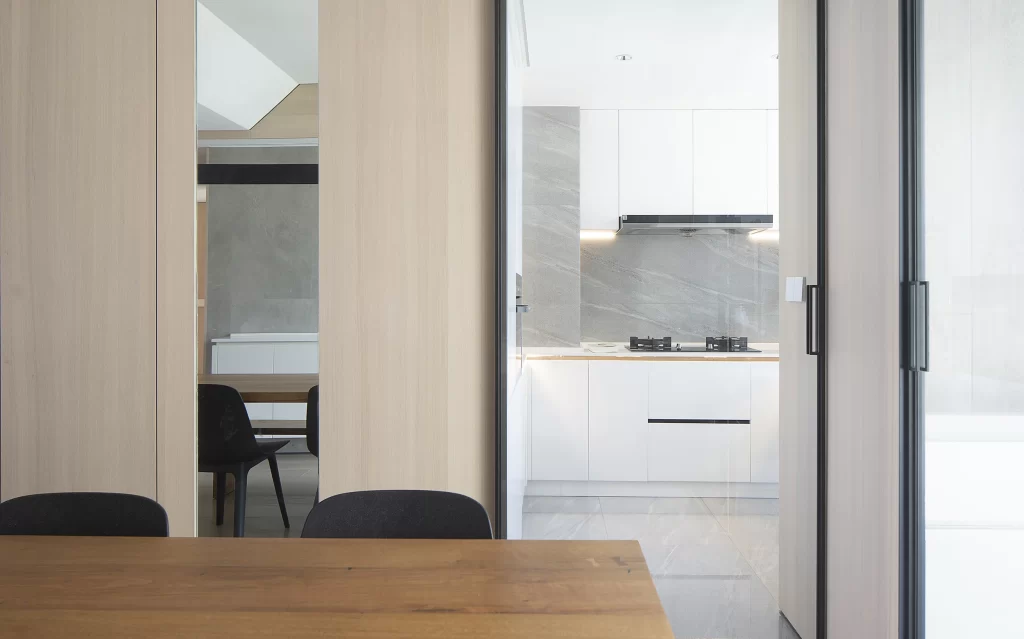 Kitchen Dining Area White Wood Minimalist Black Chairs Natural Light