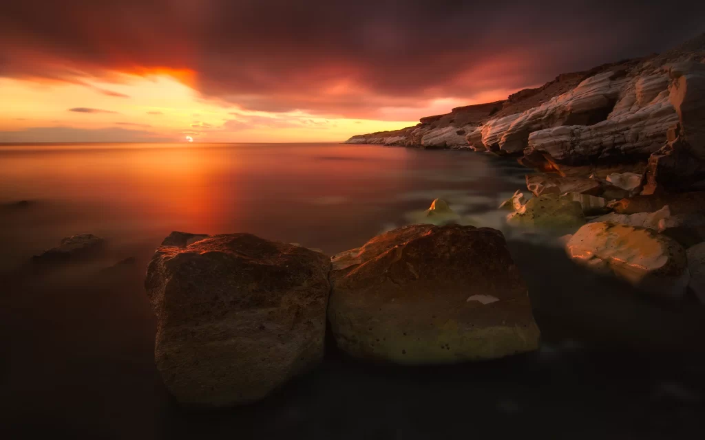 Sunset Orange Clouds Rocky Shore Ocean Reflection