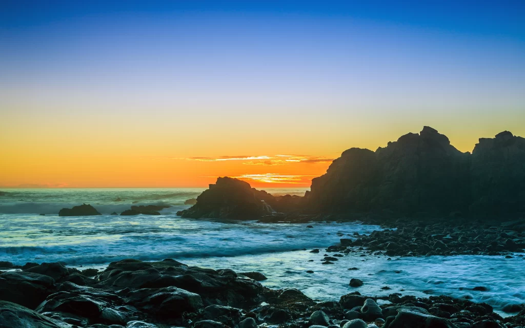Sunset Ocean Waves Rocky Shoreline Silhouette