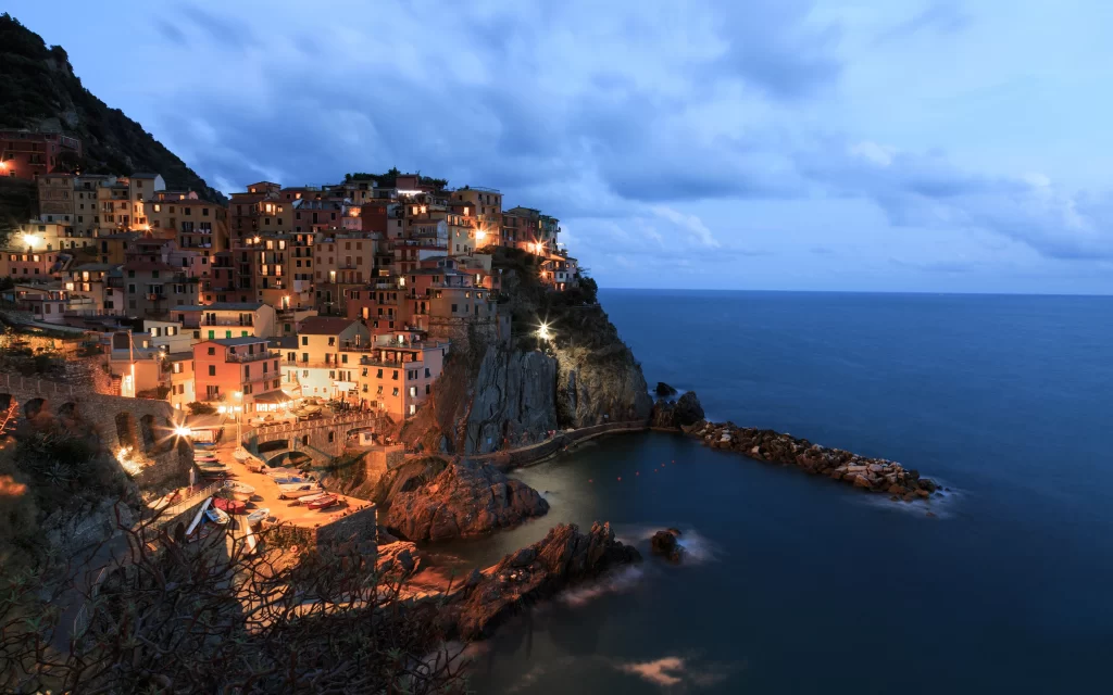 Twilight Coastal Village Colorful Houses Sea Rocks