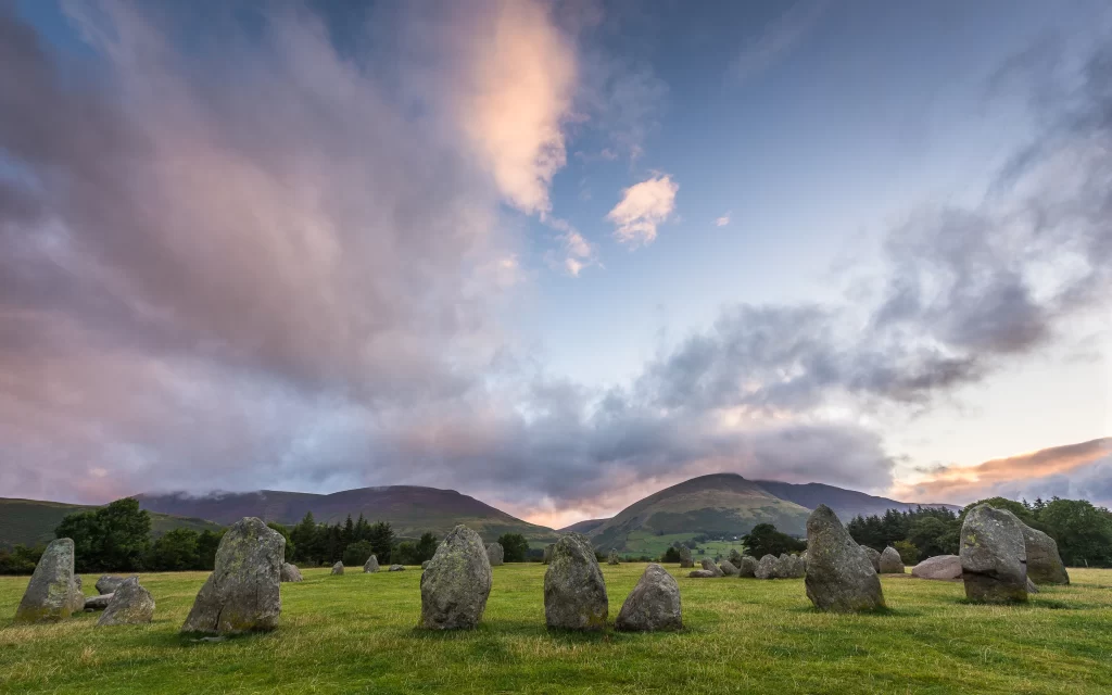 Stone Circle Cloudy Sky Mountains Green Grass Ancient