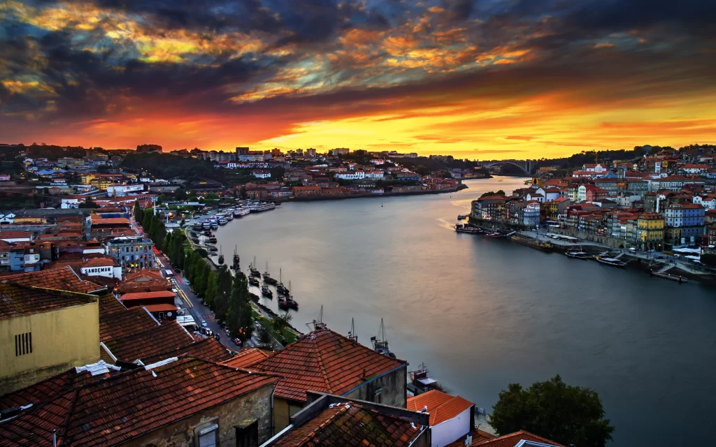Sunset River Cityscape Houses Boats Bridge