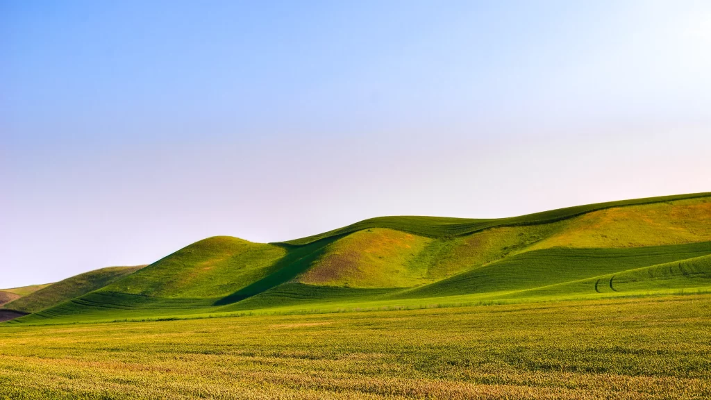 landscape hills green field sky sunlight