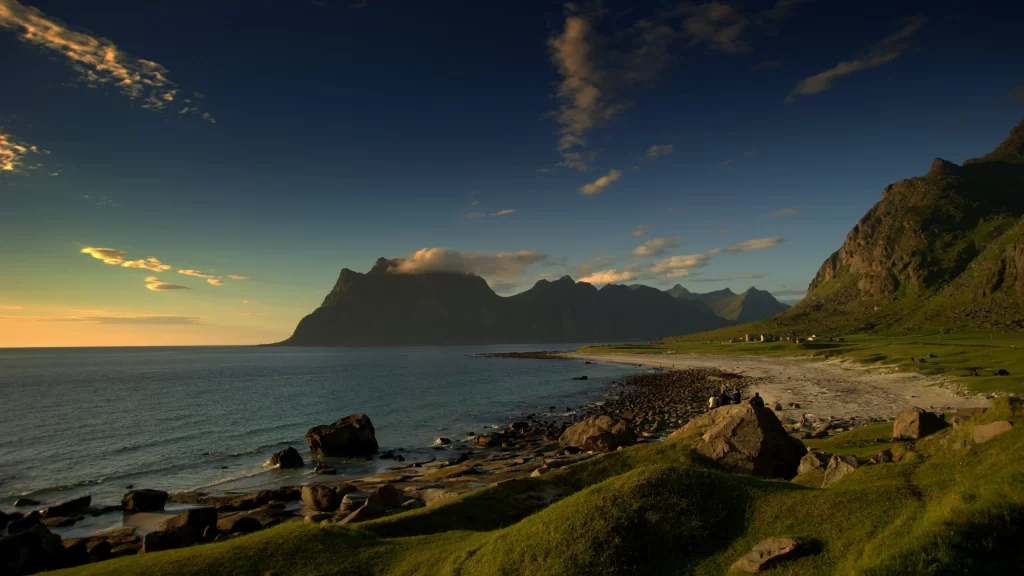 landscape mountains ocean sunset grass rocks