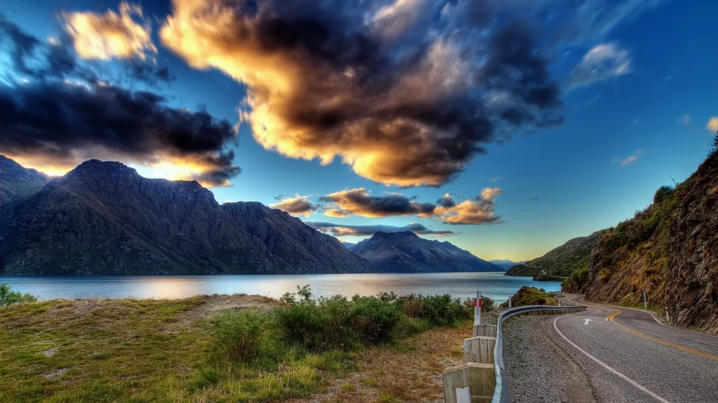 landscape road mountains lake clouds sunset