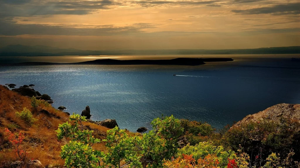 landscape sunset ocean island vegetation rocks