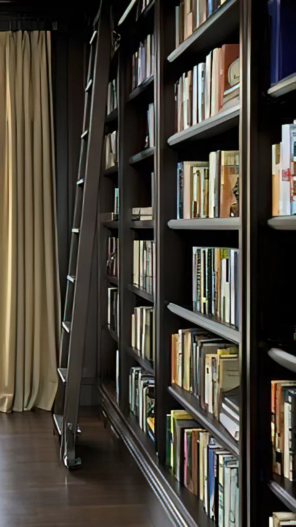 Library With Rolling Ladder and Floor to Ceiling Bookshelf