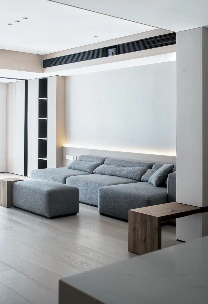 Living Room Minimalist Grey Sofa Neutral Tones Soft Lighting