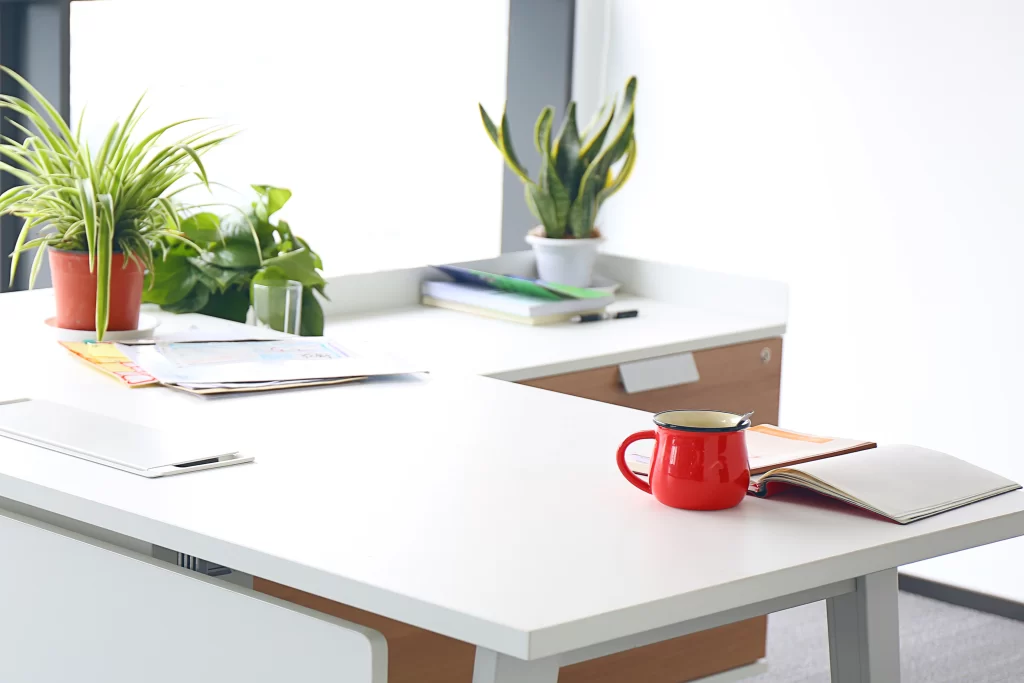 Minimalist Bright Workspace with Red Coffee Mug