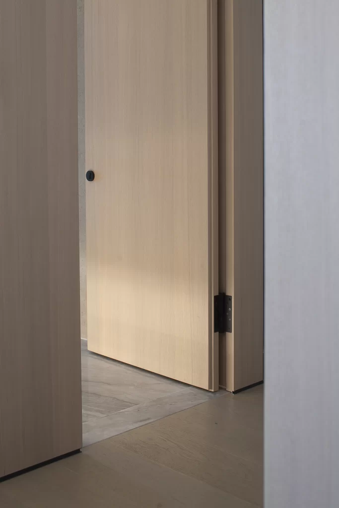 Minimalist Door Neutral Tones Wood Flooring Simple Hardware