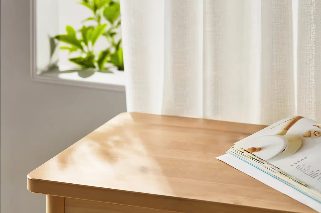 Minimalist Light Wood Table with Magazine in Sunlit Room