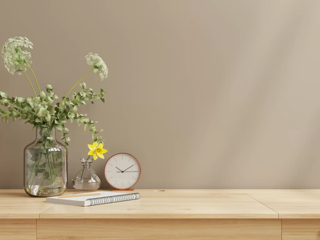 Minimalist Wooden Desk Workspace with Fresh Flowers and Clock