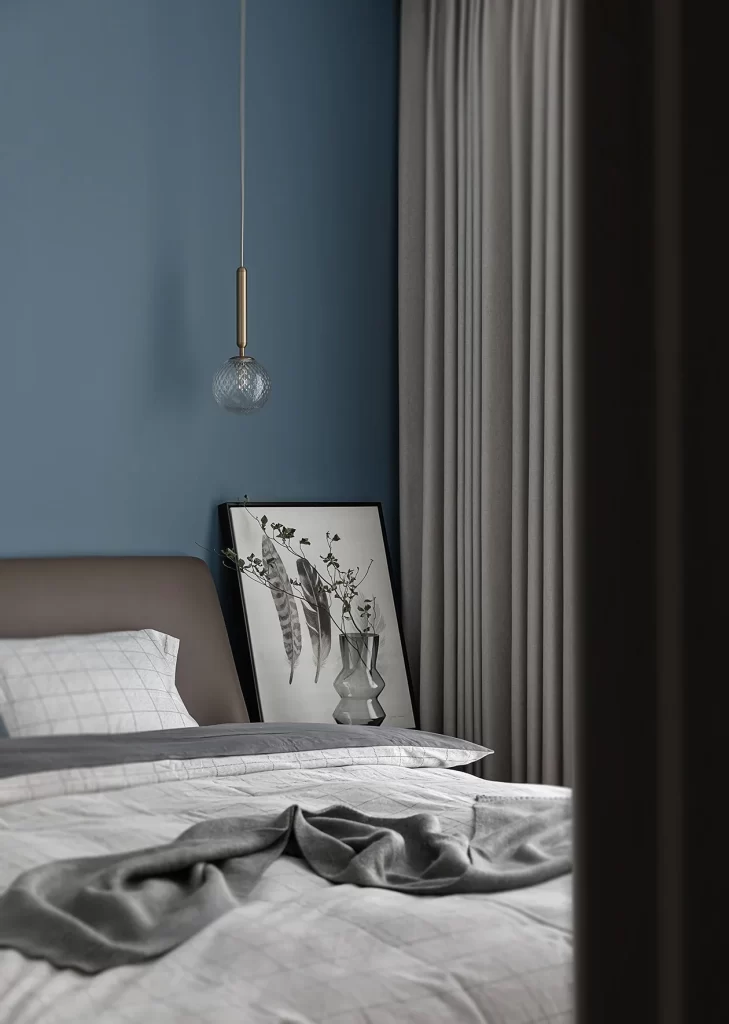 Modern Bedroom Blue Walls Neutral Curtains Bedside Table Pendant Light
