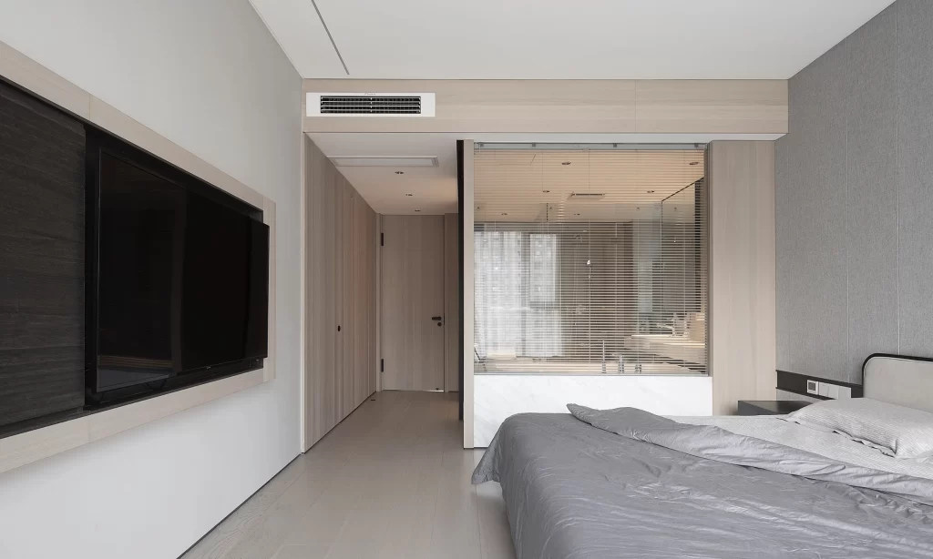 Modern Bedroom Neutral Tones Minimalist Bed Flat Screen Tv Soft Lighting