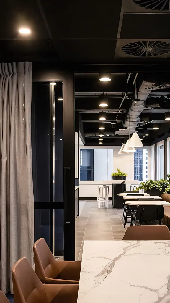 Modern Industrial Office Lounge with Marble Table and Pendant Lights