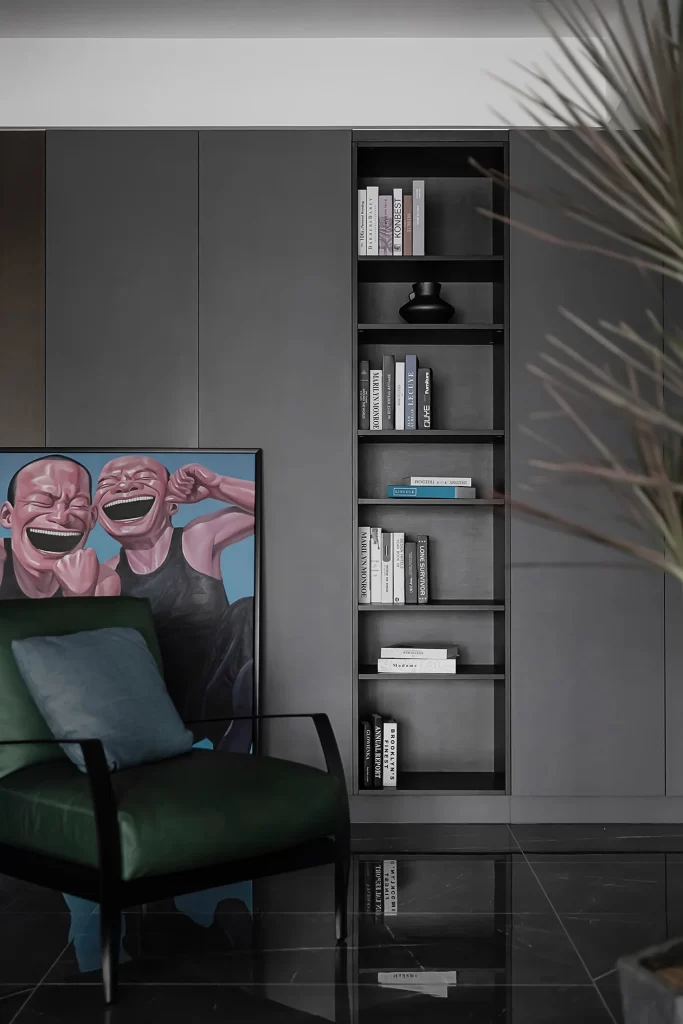 Modern Living Room Dark Tones Minimalist Bookshelf Green Chair Artistic Painting
