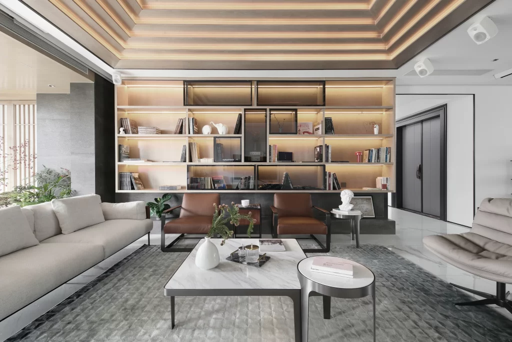 Modern Living Room Neutral Tones Minimalist Bookshelf Leather Chairs Marble Coffee Table