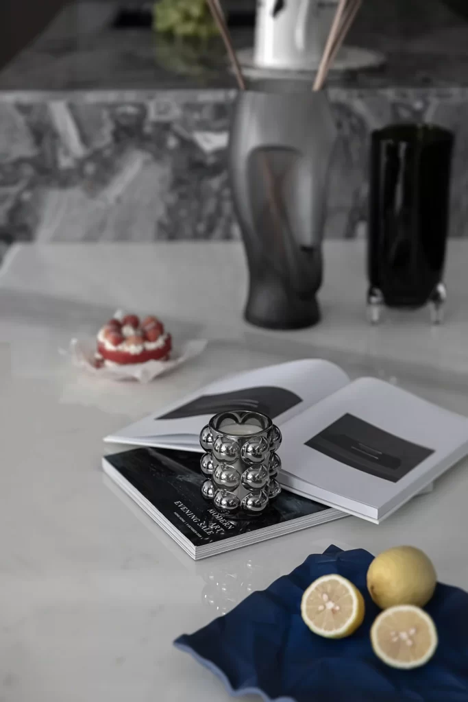 Modern Minimalist White Countertop Metallic Accents Open Book