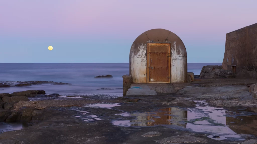moonlight seaside structure reflection calm