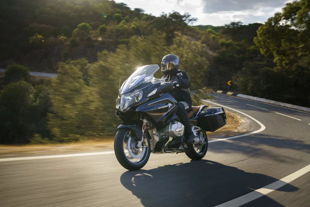 motorcycle road rider helmet landscape sunlight