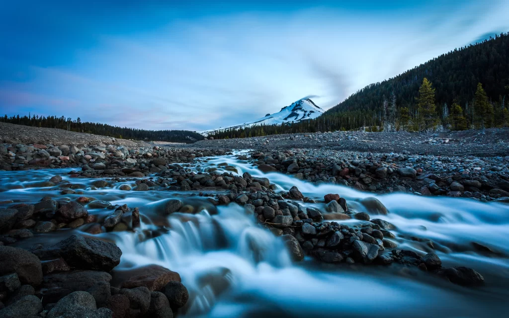 mountain stream rocks twilight sky