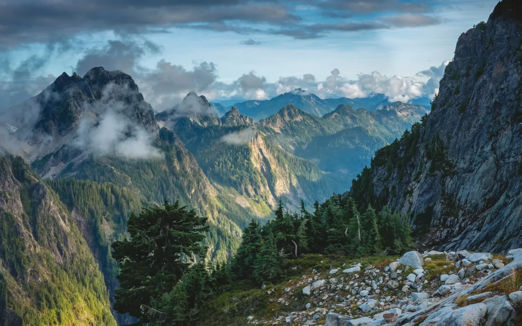 mountains clouds forest rocks sunlight landscape