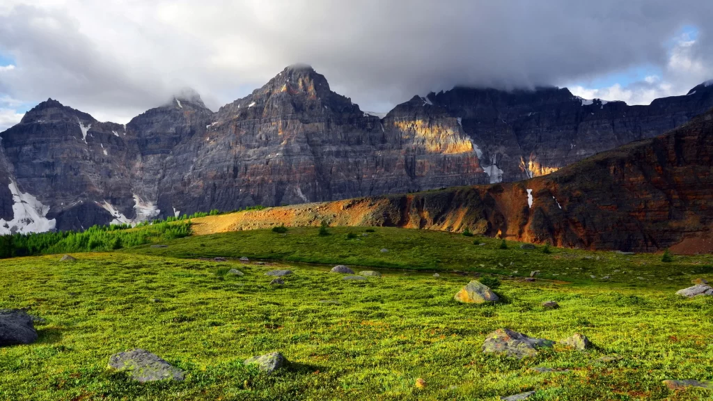 mountains clouds greenery rocks sunlight landscape