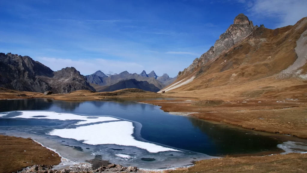 mountains lake ice blue sky