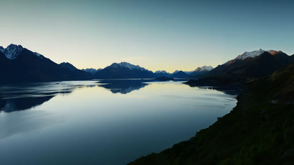 mountains lake reflection sky sunrise nature