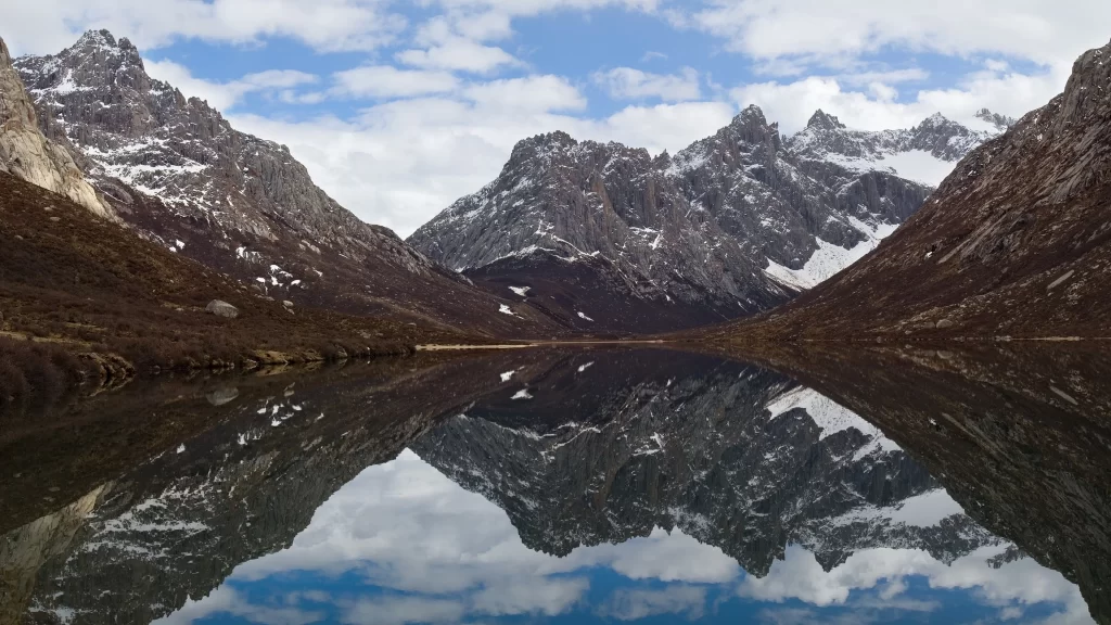 mountains lake reflection snow sky