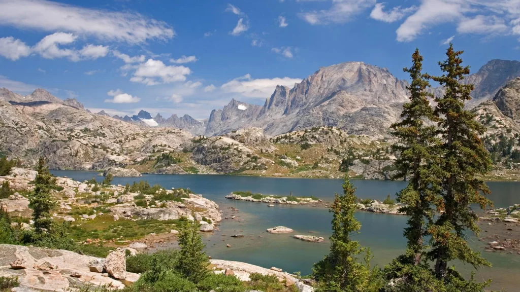 mountains lake trees sky rocks