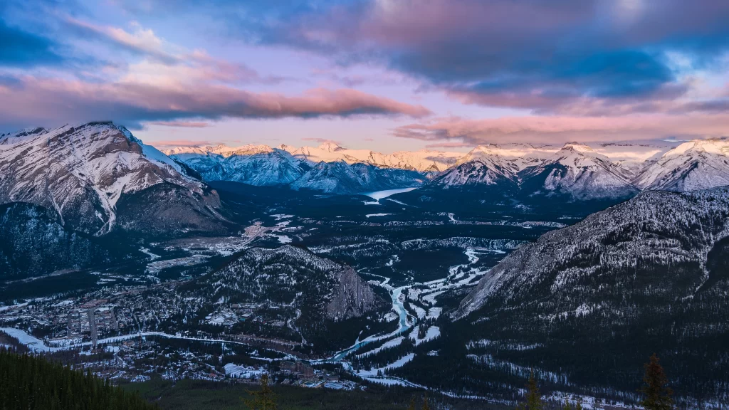 mountains snow clouds river valley