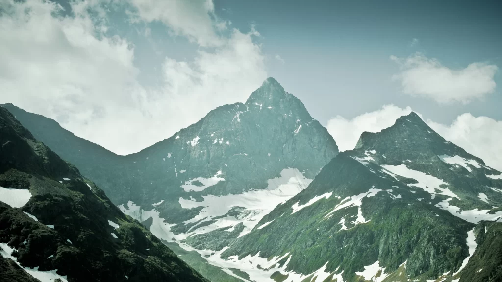 mountains snow clouds sky green