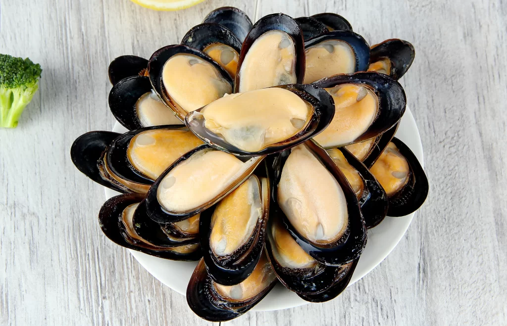 Mussels Open Shell Orange Flesh Black Shell White Plate