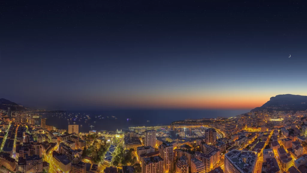 night cityscape ocean lights buildings