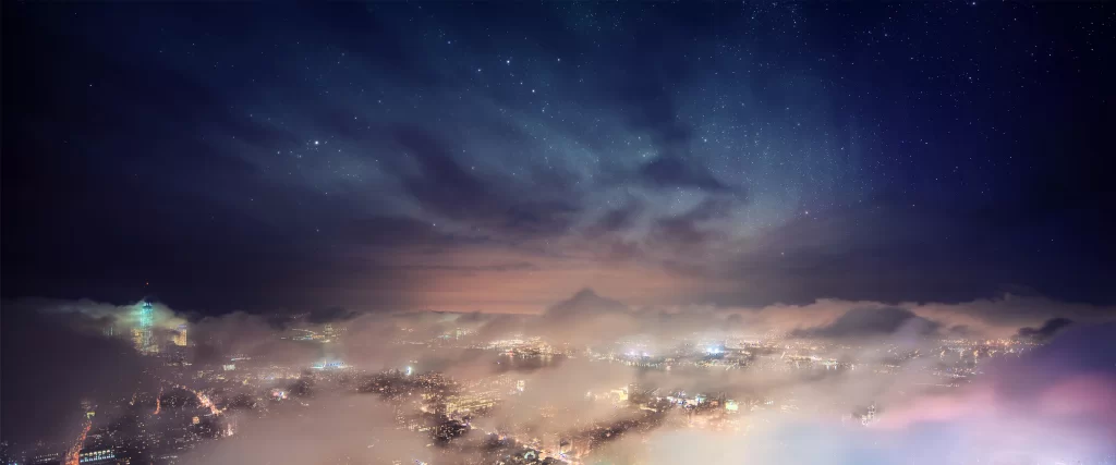 night cityscape stars clouds lights mist