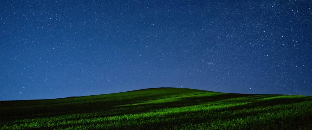 night sky stars grass hill landscape